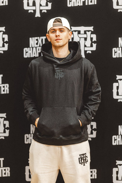 THE NEXT CHAPTER — Blacked-Out Essential Hoodie